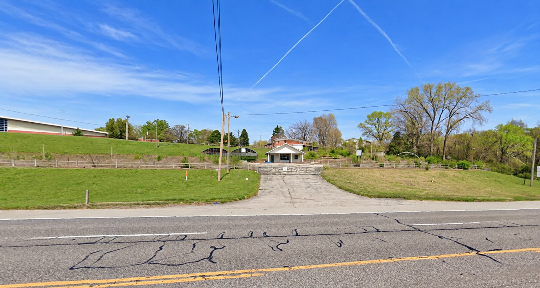 The current Pharm Fresh Place property, with its entrance, building, greenhouses, and surrounding green space